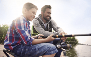 Picture of father and son on a Broken Bow Lake fishing adventure.