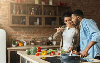 Picture of couple trying some Oklahoma food recipes.