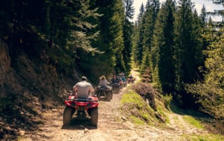 A photo of a group riding around Broken Bow trails on ATV rentals.