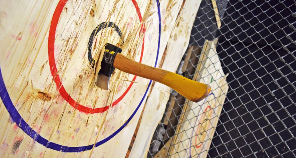 A photo of axe throwing, one of the many things to do in Hochatown.