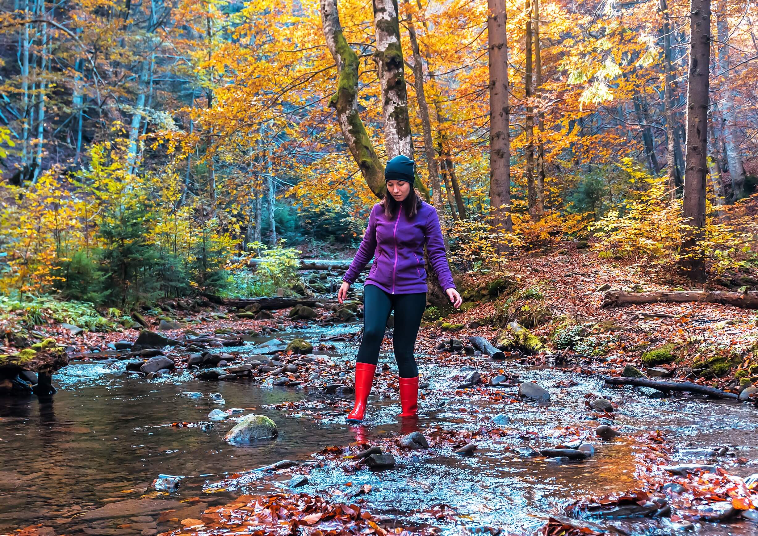 A woman enjoying Broken Bow Hiking during fall.