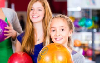 Two girls Bowling in Broken Bow.