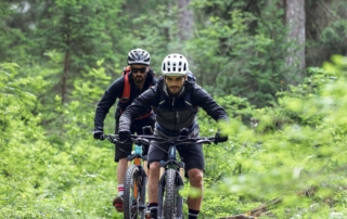 Two bikers on a Mountain Biking Trail.