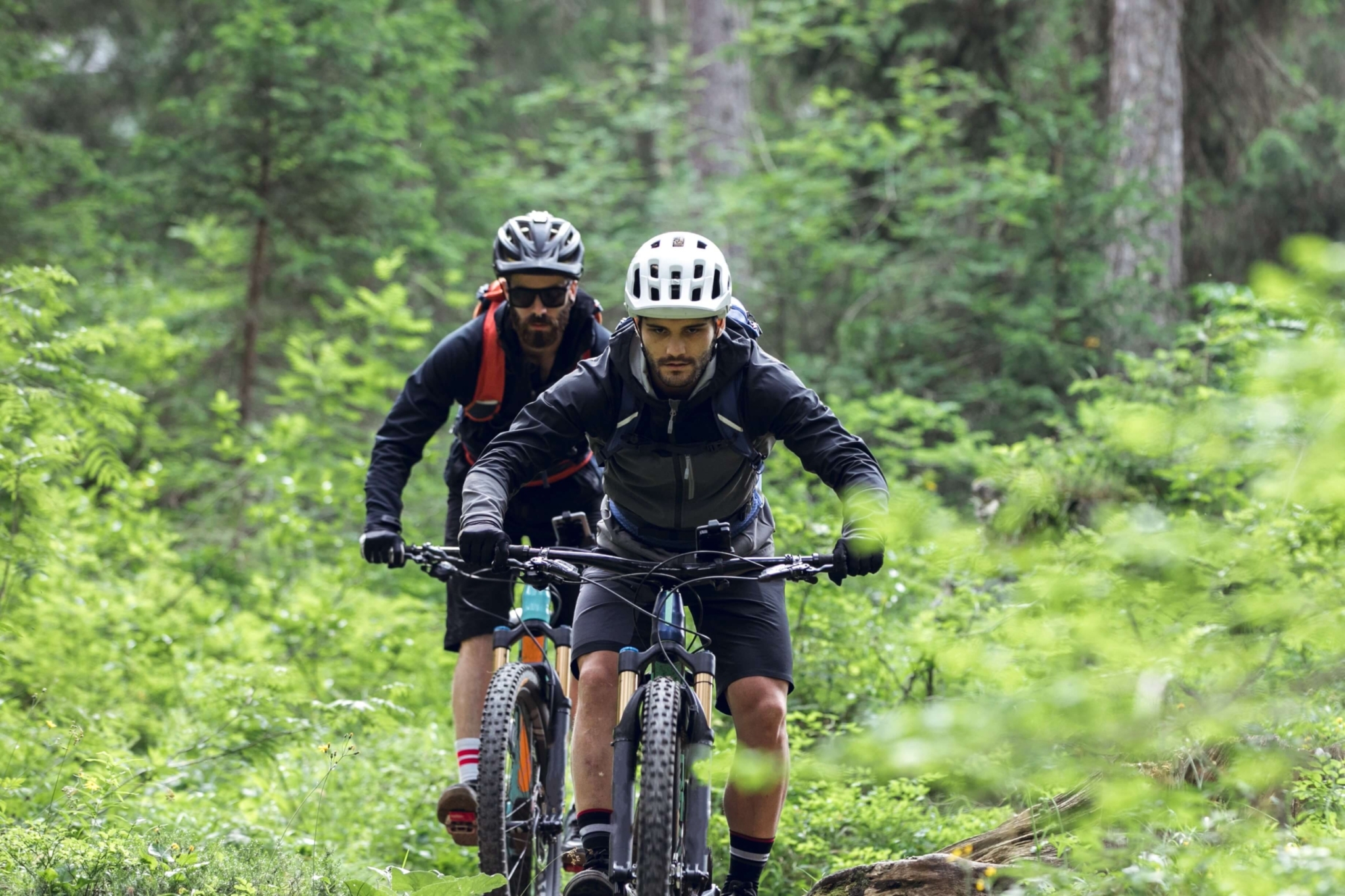 Two bikers on a Mountain Biking Trail.