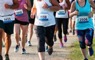 A group of people running, which one of the Things To Do In Broken Bow.